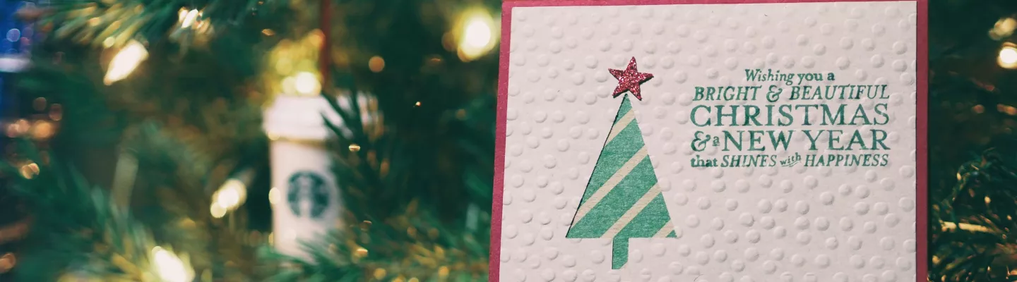 Christmas card hanging from tree