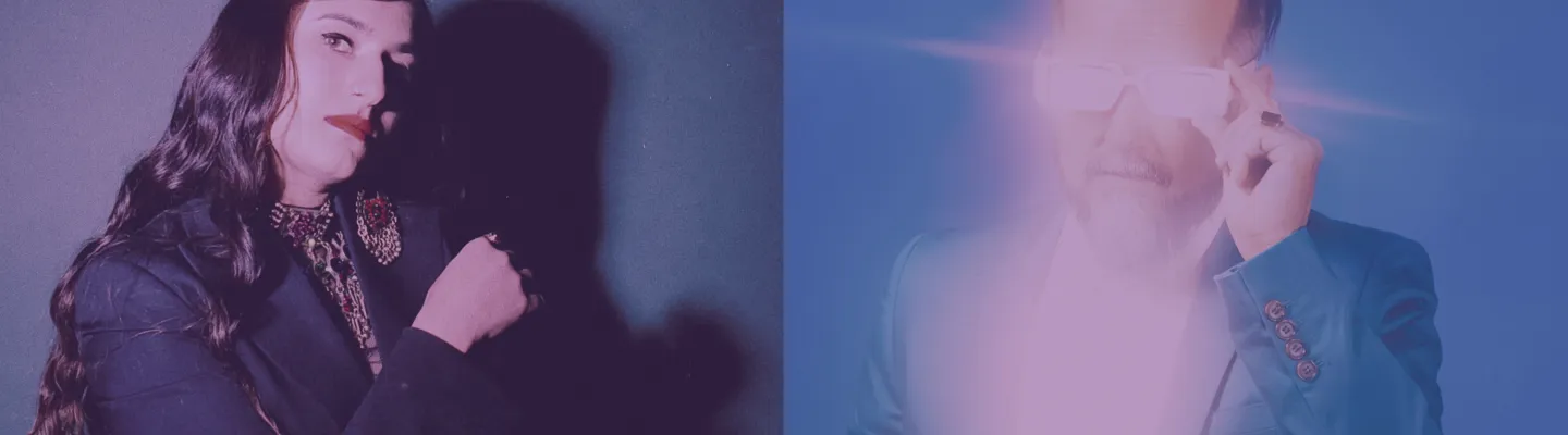 Person on the left has long wavy brown hair and a black jacket, looking judgingly at the audience. Person on the right is obscured by the white reflection of their sunglasses and white shirt