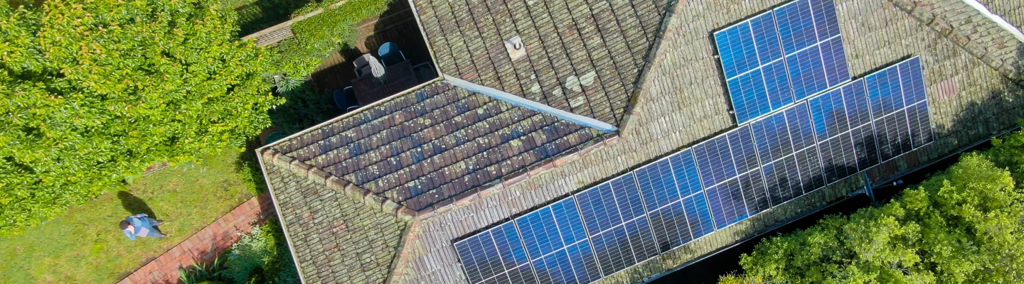 An array of solar panels on a tiled roof