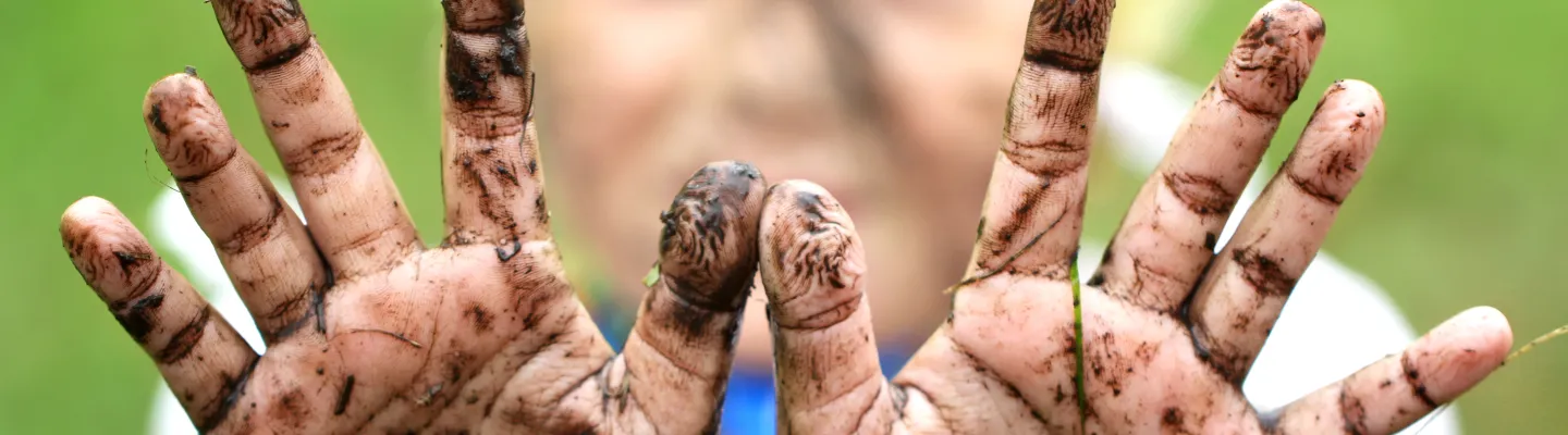 A child with dirty hands.