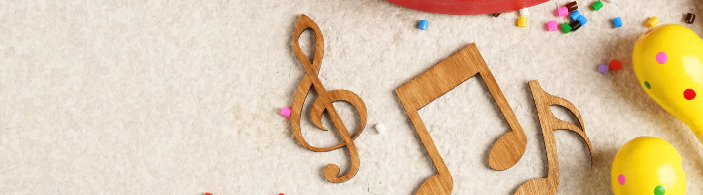 Wooden music notes and maracas