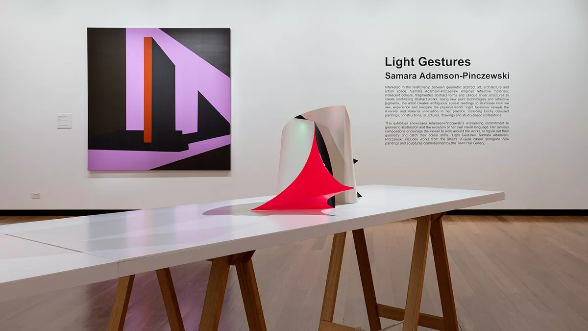 Installation view of 'Light Gestures' at Town Hall Gallery. Abstract geometric painting on the wall. Square canvas with pillar-like shapes.