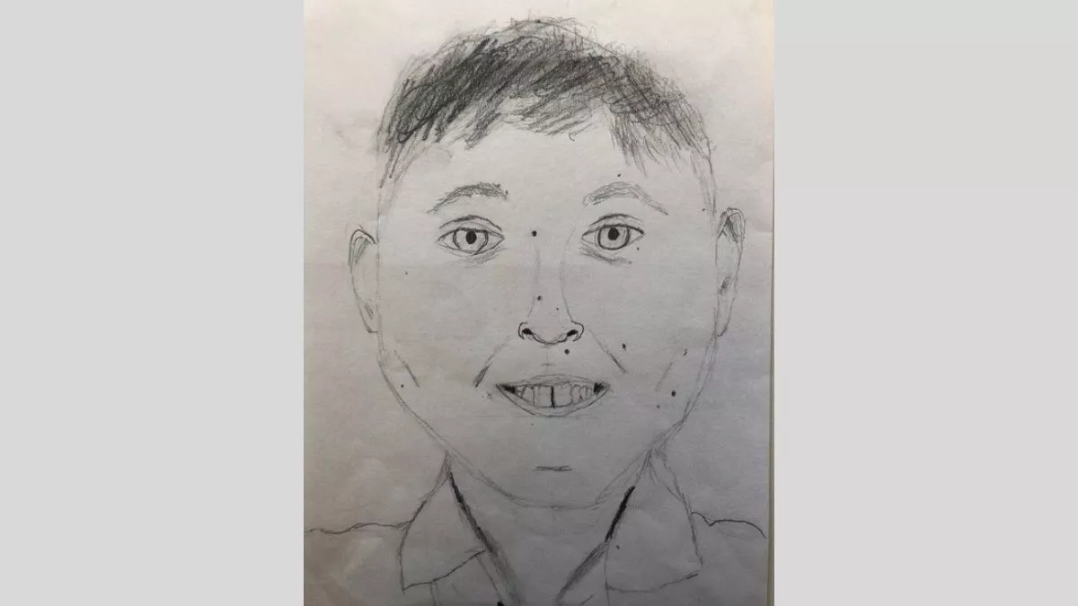 Self portrait by Samuel, done with grey lead pencil on paper.