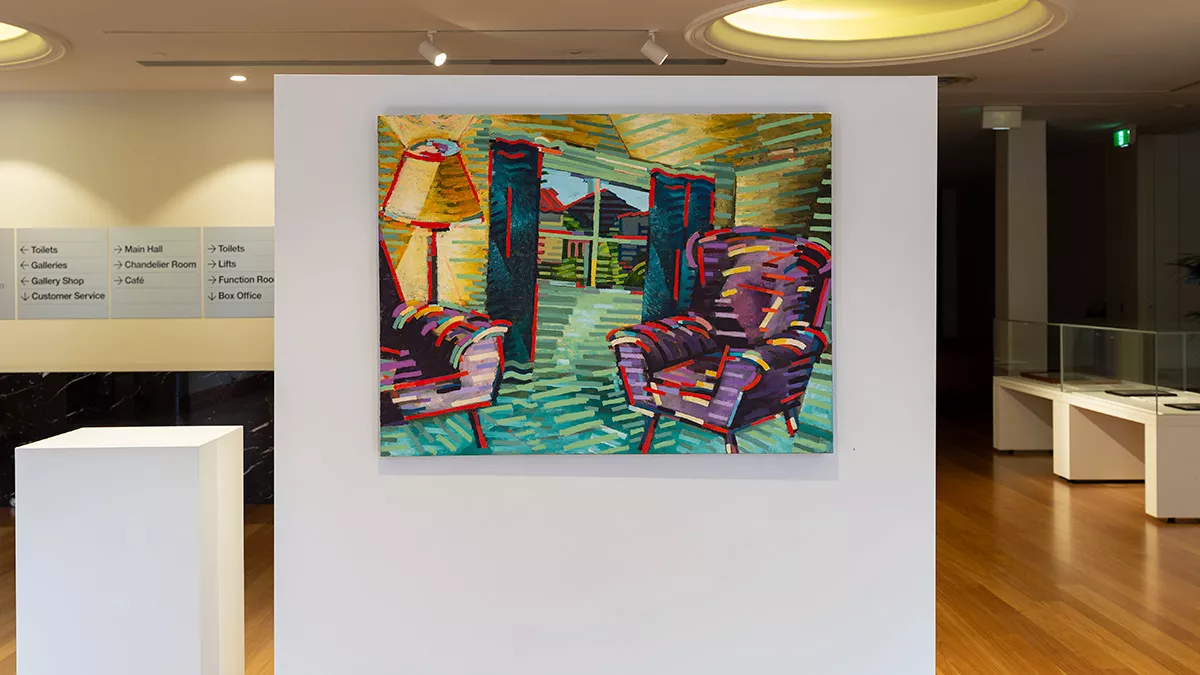 Painting of a lounge or sitting room, with two comfy armchairs, a standing lamp and a view out the curtained window to the house across the road.