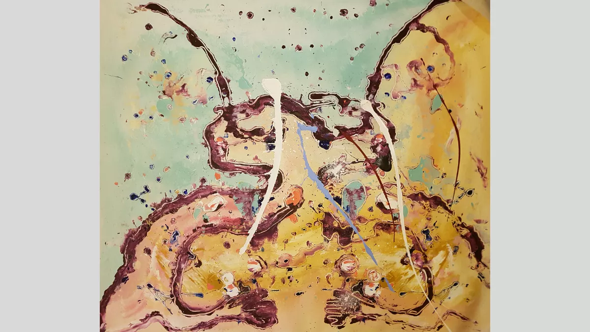 Swirls and splashes of paint across a yellow and blue canvas