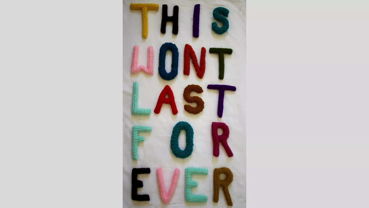 Crocheted letters in different coloured wool spelling out 'This wont last for ever'