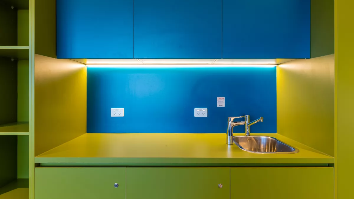 A yellow and blue coloured kitchen