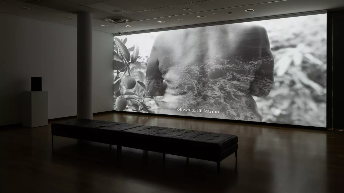 black and white cinematic image of a woman's back