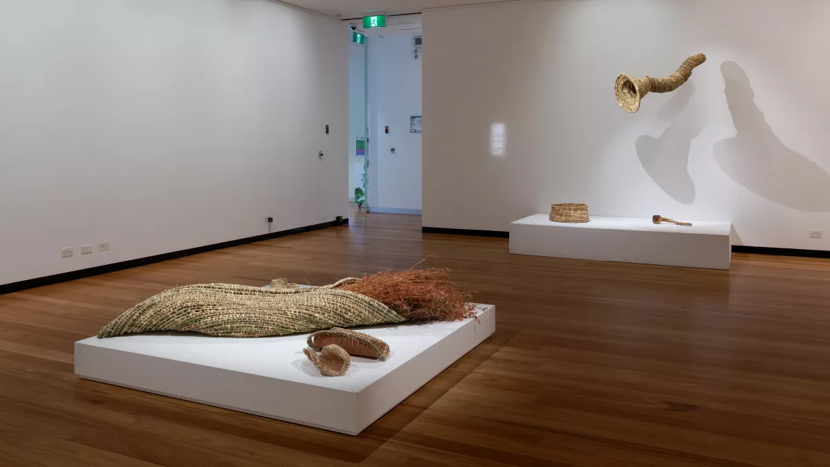 art installation of sculptures made of reeds and grasses