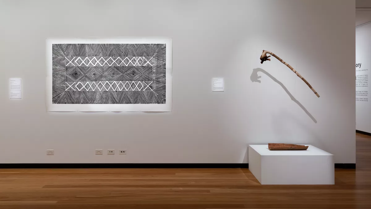 black and white abstract print on a white wall