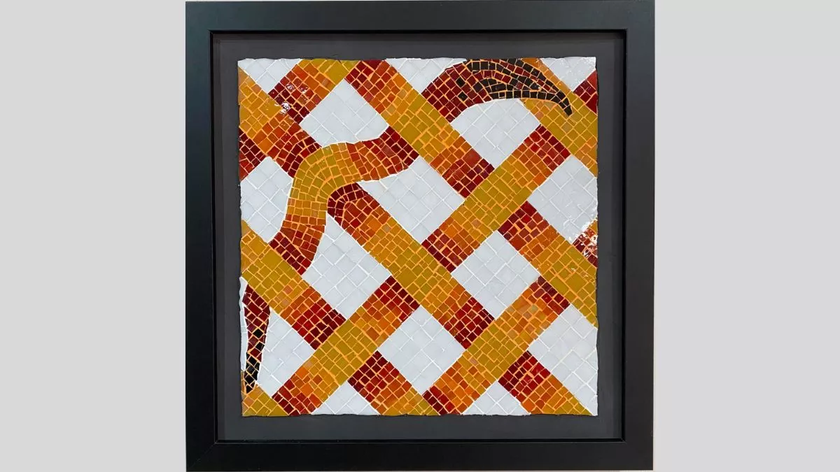 An artwork featuring a mosaic with diagonally thatched strips that are red, orange and yellow, and one diagonal strip is wavy like a snake