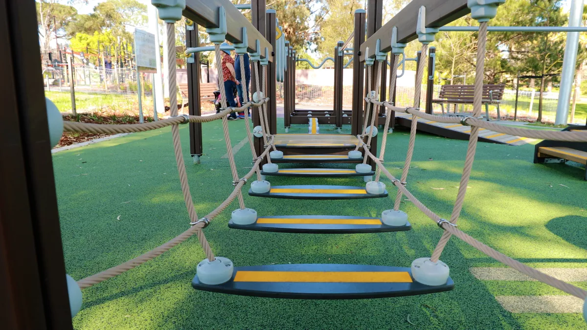 a rope climbing structure at a playground