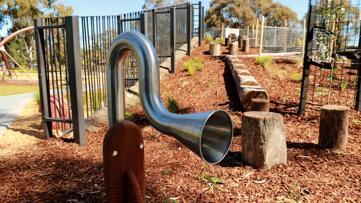 a stainless steel musical instrument at a playground