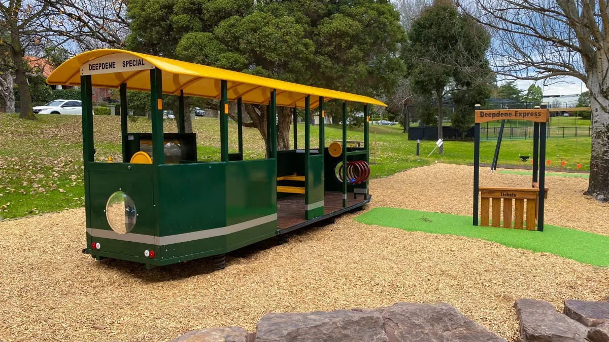 A play tram for children to play inside in a playground