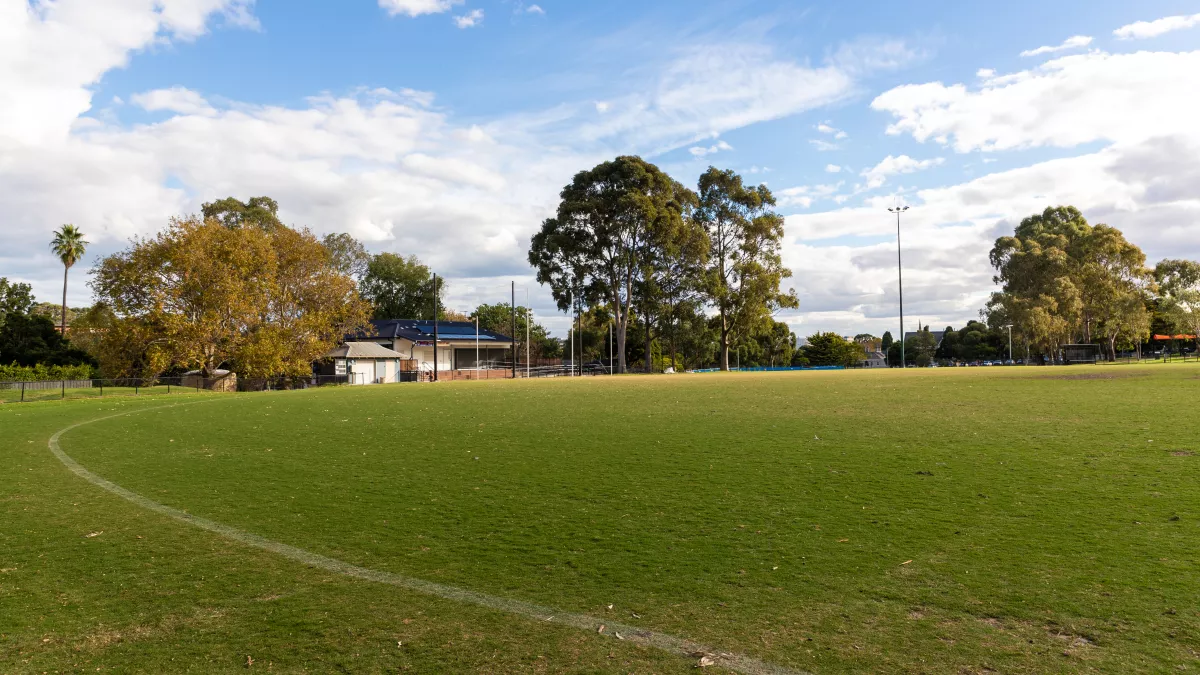 A white line marks the boundary of a sports oval