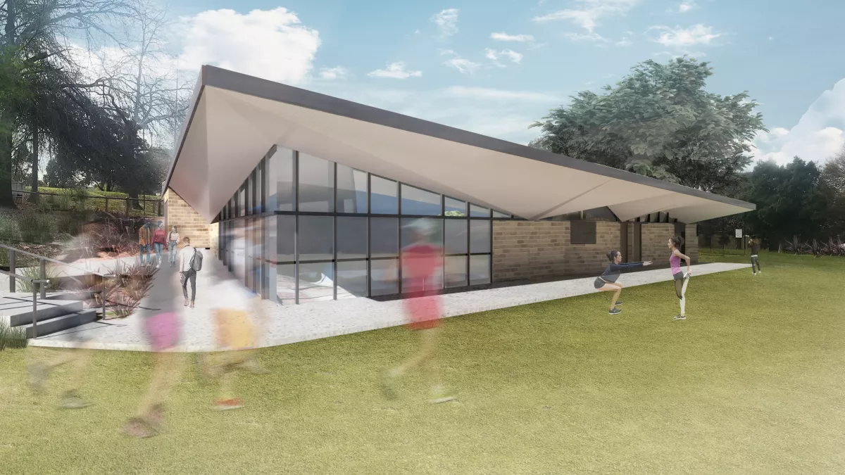 Rendered view of the proposed pavilion building from the southern oval, surrounded by vibrant green grass with people depicted enjoying the area.