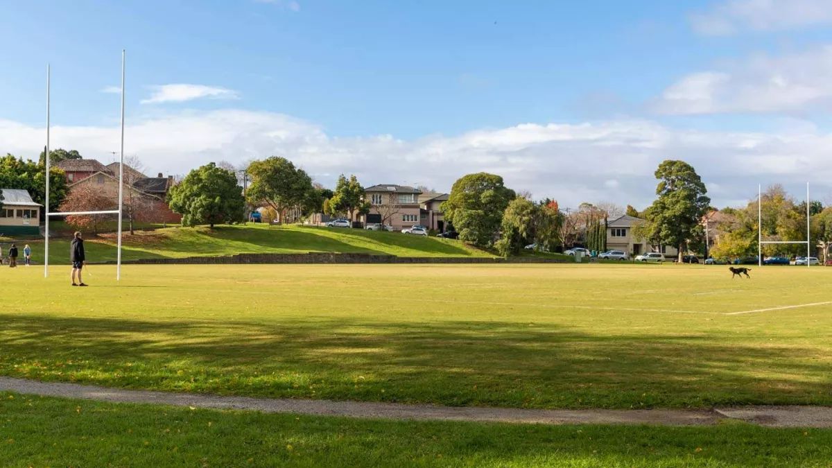 A sportsground featuring rugby goal posts