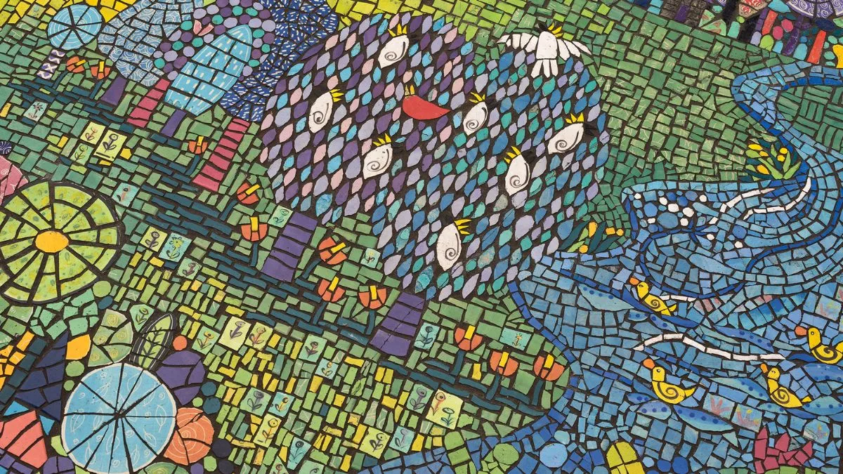 A colourful mosaic trees, hills and waterways. cockatoos are in the trees and duck on the water