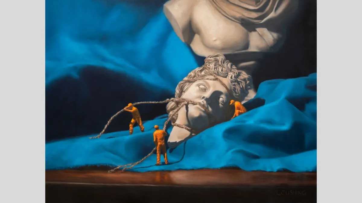 A hyper realistic painting showing a broken classical marble statue of Apollo resting on bright blue drapery. The head lies detached in the foreground, with three miniature figures in orange hazmat suits pulling ropes around it as if recovering an artifact.