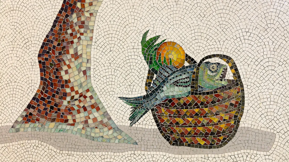 A close up photograph of a mosaic of a fish in a basket