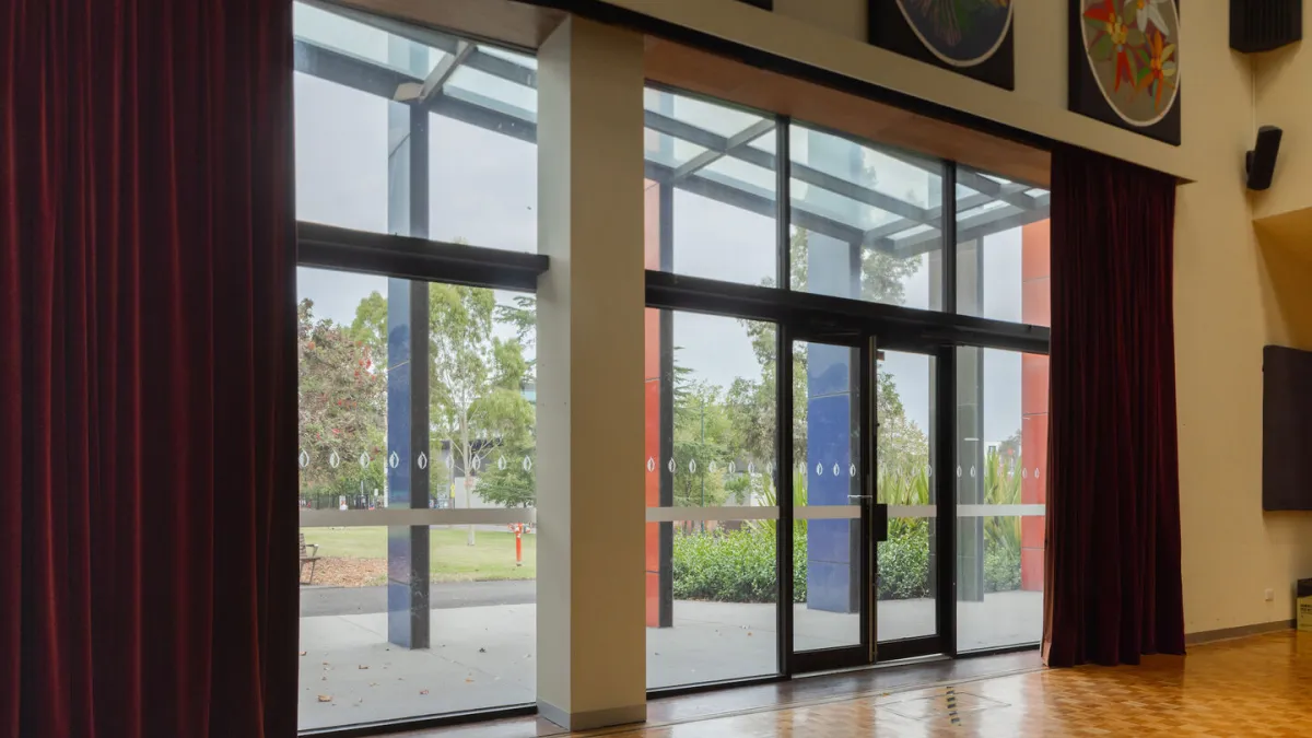 Glass doors looking out into a park area