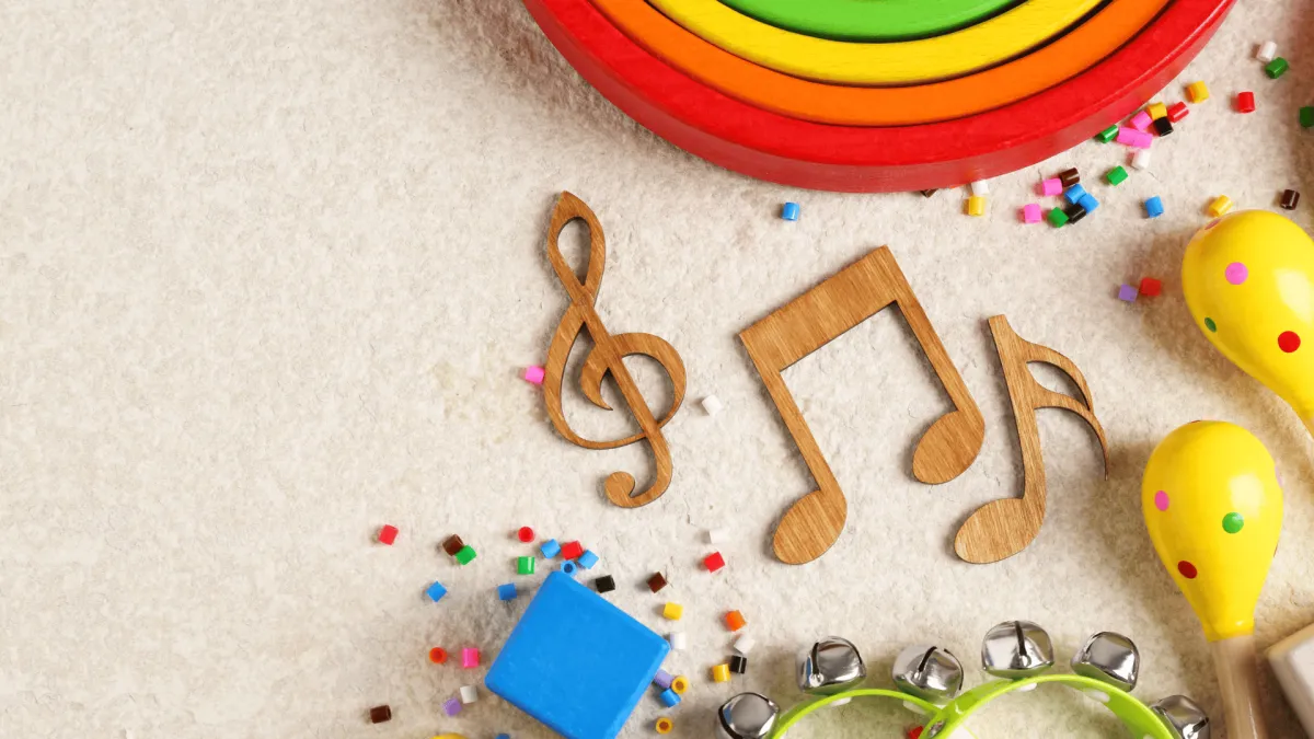 Wooden music notes and maracas