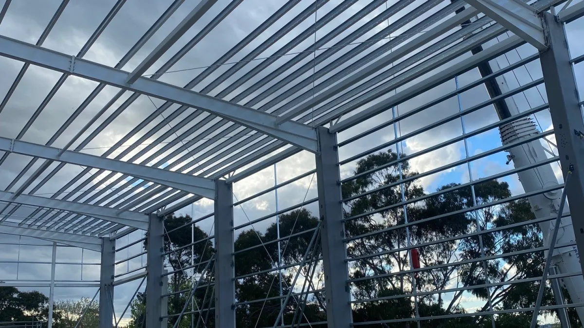 Steelwork progressing on sports courts.