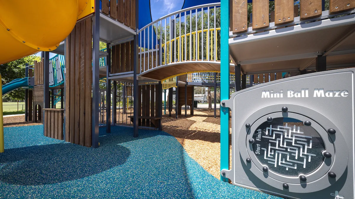 Timber climbing frame structure and maze in a playground