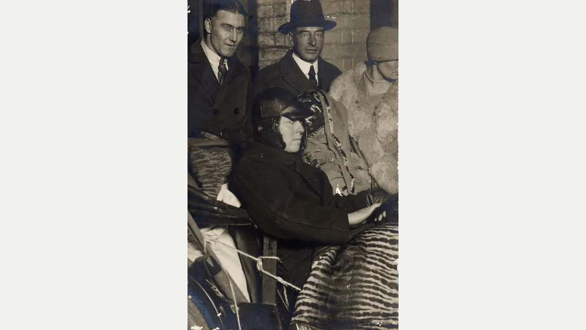 Two Flapper women in a car with leopard print