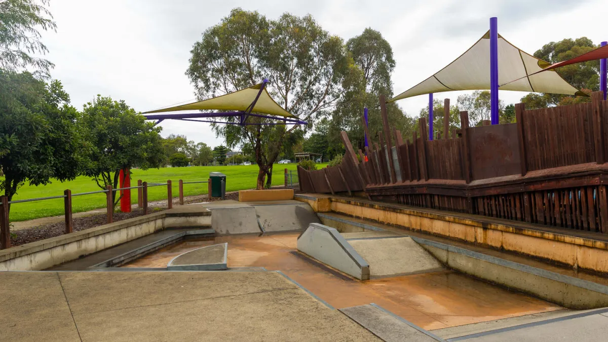 A suken skating area with park lawns in the background. 