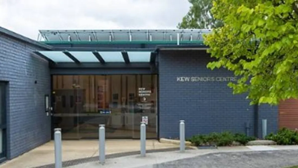 A grey building exterior with glass doors leads into the Kew Seniors Centre.