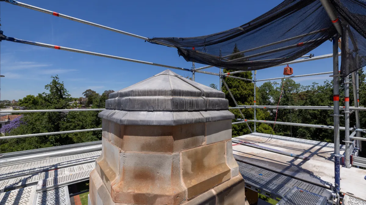 Restoration work at the top of the memorial showing resurfaced and replaced stone.