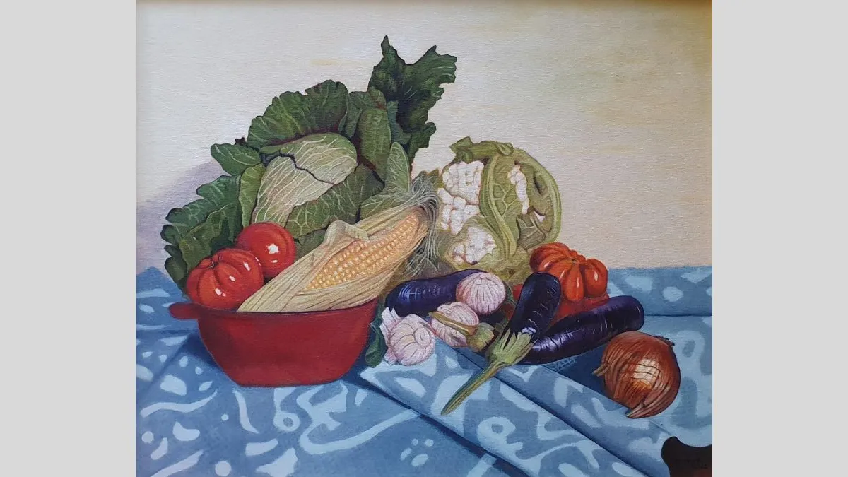 A still-life painting showing assorted vegetables arranged on a patterned, folded blue cloth. The composition includes a red bowl filled with cabbage, tomatoes, and an ear of corn, with cauliflower, eggplants, garlic, an onion, and another tomato placed beside it. 