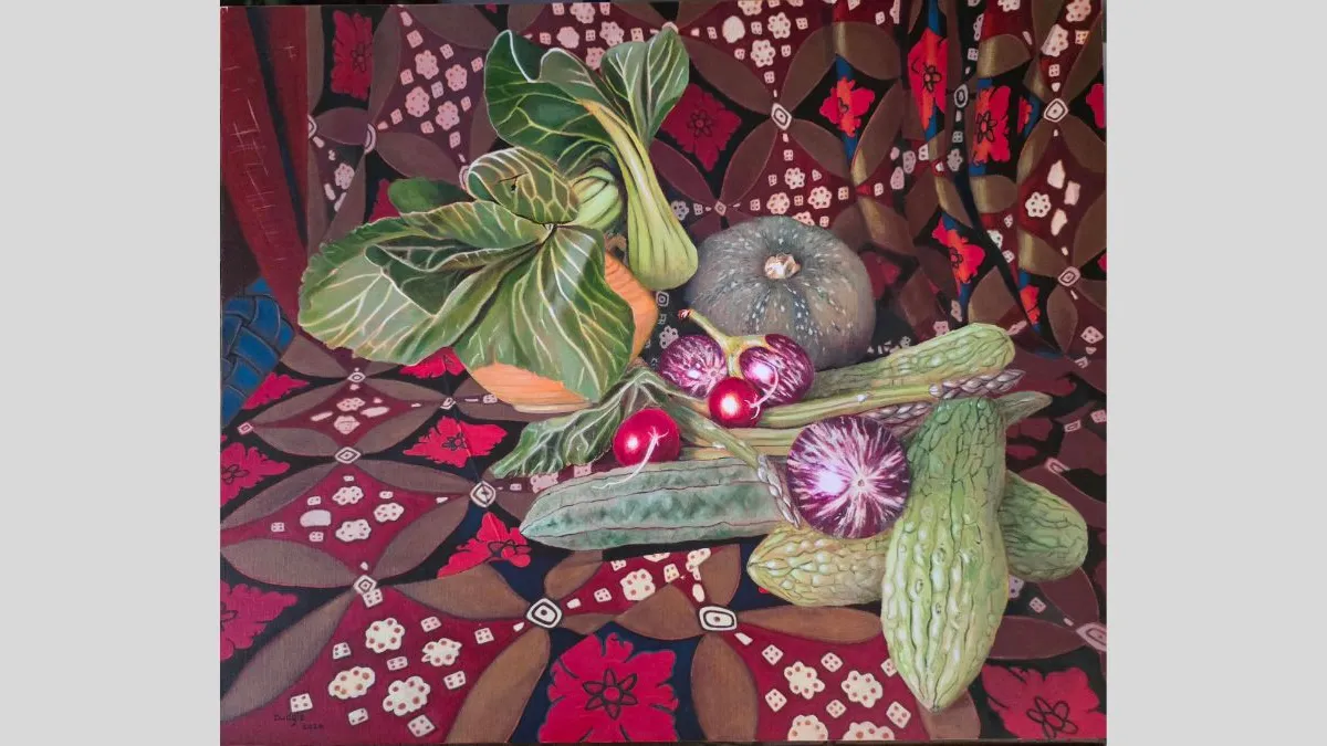 A still-life painting of vegetables arranged on a floral, patterned fabric. Visible items include leafy greens, a pumpkin, cucumbers, radishes, and cut root vegetables. The produce is clustered toward the center over the detailed textile, which has pulled up behind the vegetables to also serve as a background for the scene. 