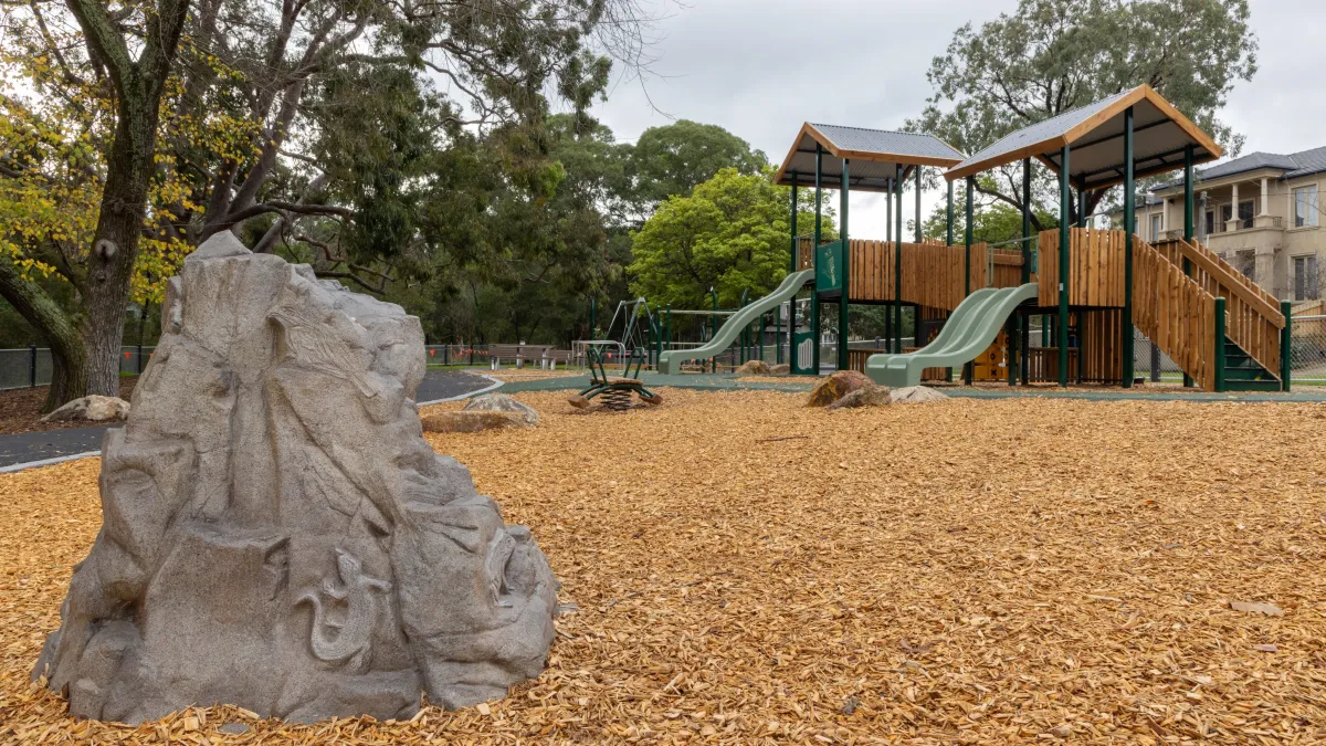 A playground with sheltered timber play units