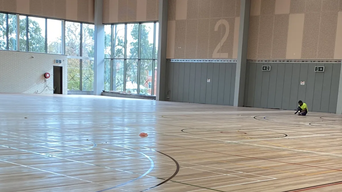 A freshly laid timber floor in a sports stadium