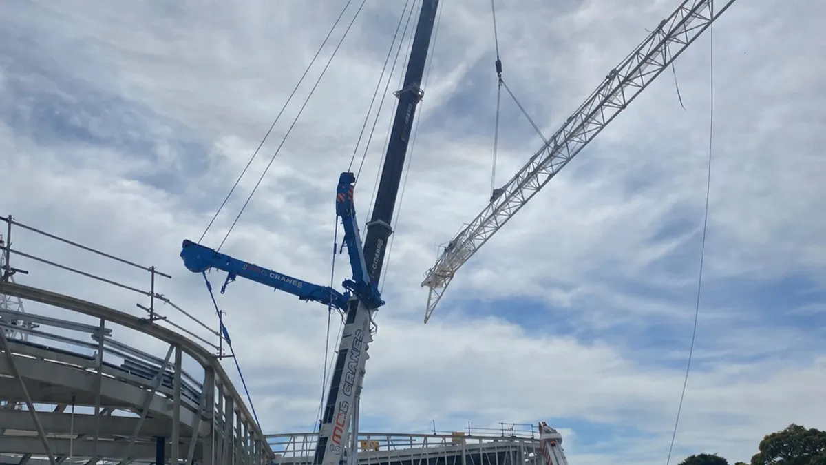 A crane lifting a bit of metal