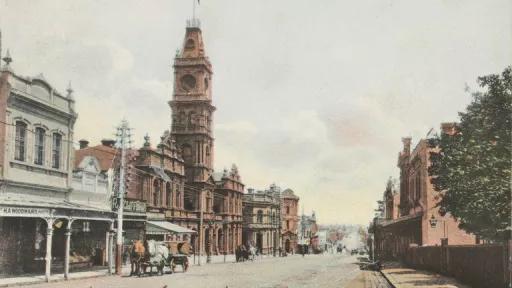 Looking west down Burwood road with shops and the Town Hall on the left
