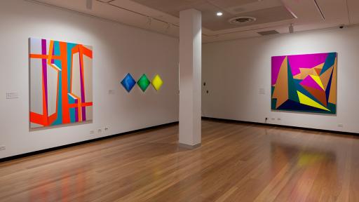 Installation view of 'Light Gestures' at Town Hall Gallery. Abstract geometric paintings on the walls.