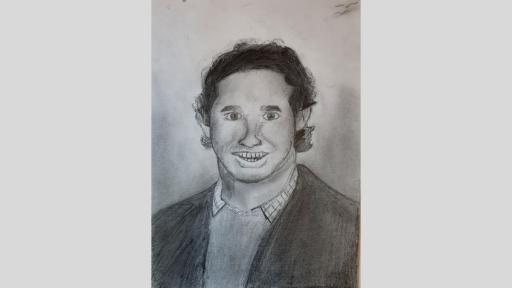 Graphite drawing of Mr Gross. He has short curly hair and is wearing a Collared shirt and jacket. Mr Gross is smiling.