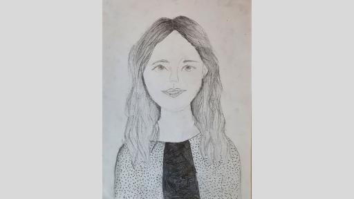 Graphite drawing of Mrs Barnes. She has long hair, is smiling and is wearing a top that is a bit like sprinkles.