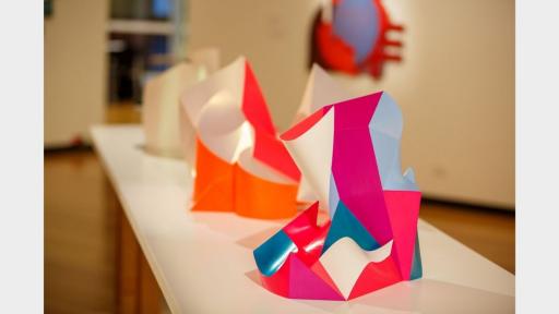 Abstract geometric sculpture with lots of angles and broad flat surfaces.