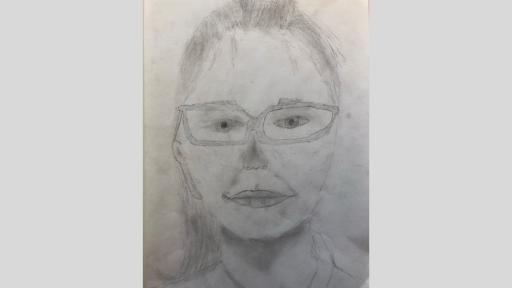 Self portrait by a student, done with grey lead pencil on paper.