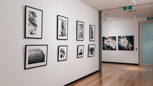 Installation view of 'Natural Constructs' at Town Hall Gallery. Close up paintings flowers by Shani Alexander on on side and photographs of the ornamental details on historical buildings in Boroondara by Jon Saroglu on the other.