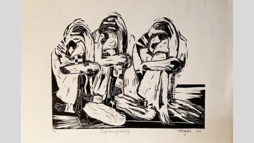 Black and white lino print of three crouched figures huddled together on the ground.