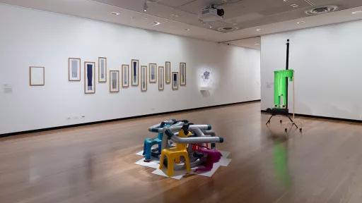 Installation view of Material Reverie at Town Hall Gallery, including scarves in frames hung on the wall