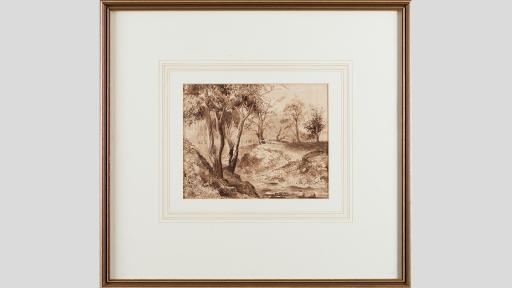 Framed artwork of a landscape with trees and hills