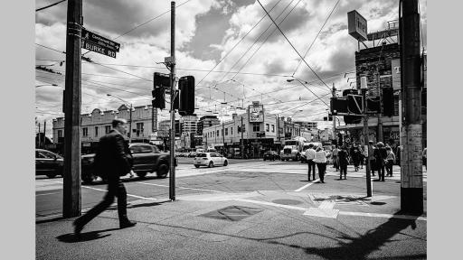 Photo by Nadja Arold of the Camberwell Junction intersection while busy, with cars and people crossing
