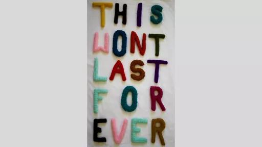 Crocheted letters in different coloured wool spelling out 'This wont last for ever'