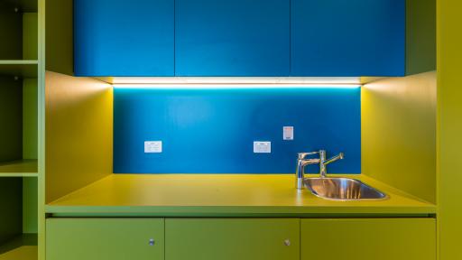 A yellow and blue coloured kitchen